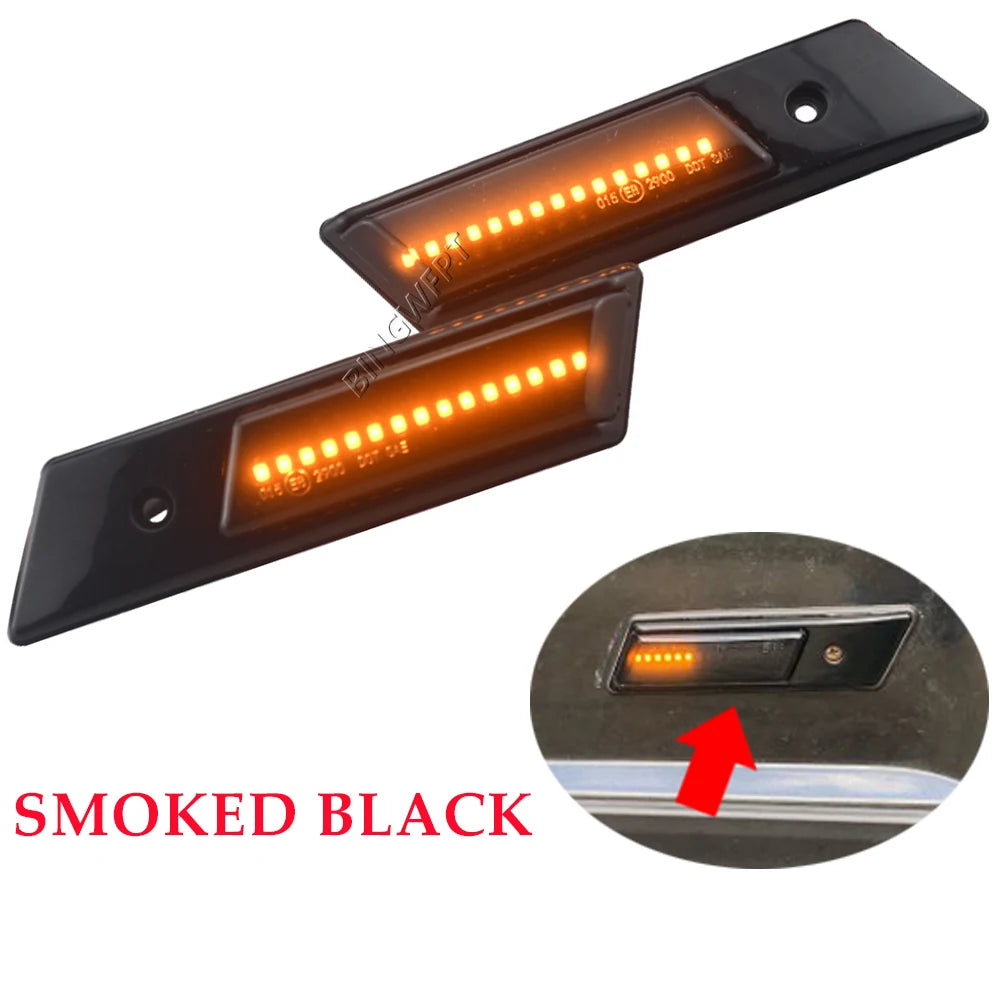 Two smoked black Dynamic LED Side Markers for BMW E32/E34/E36 (1990–1996), one shown illuminated with an orange dynamic turn signal. Inset displays an installed light on a BMW E36, highlighted by an arrow. Text reads SMOKED BLACK.
