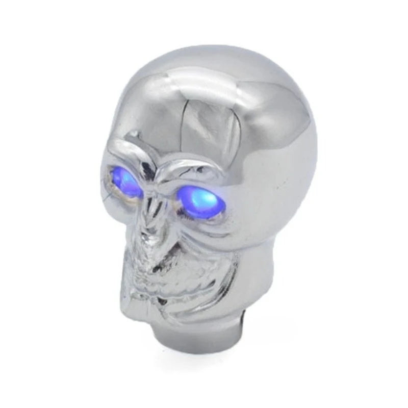 Silver Skull shift knob with blue eyes. Universal metal gear shift knob for automatic and manual transmissions.