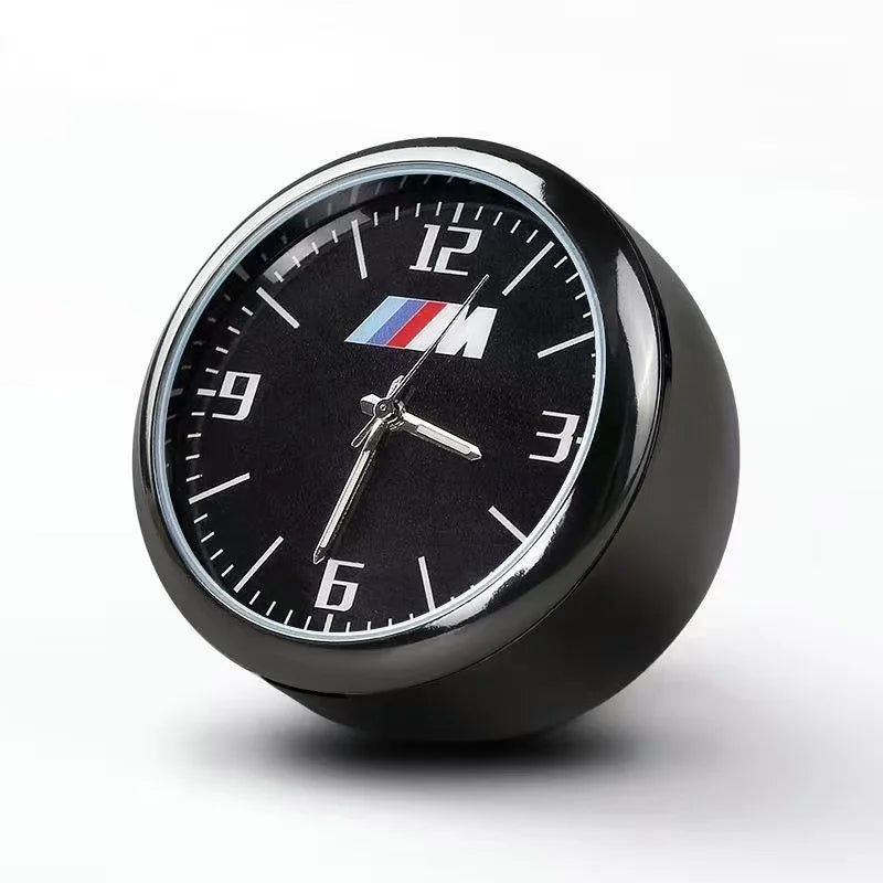 BMW-branded quartz clock with sleek air conditioner vent mount for use in E36, E39, E46, E90, F30, F10, X1, X3, X5 vehicles.