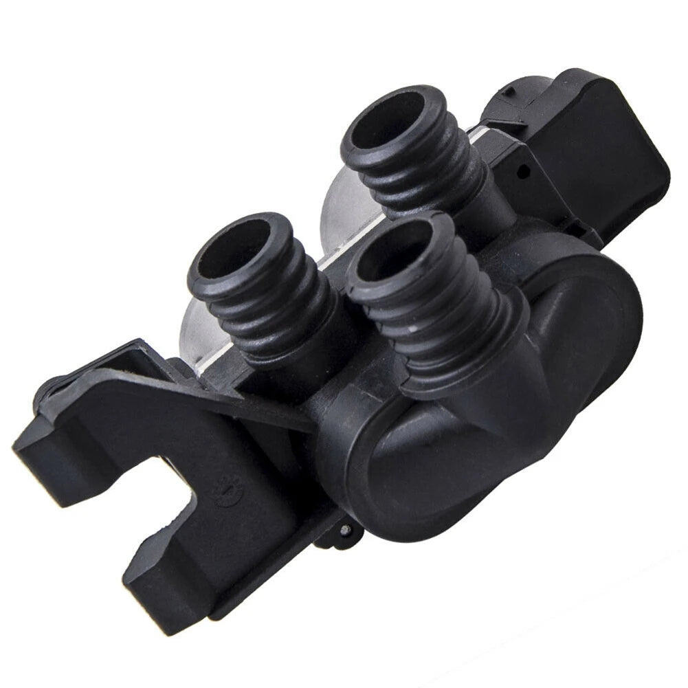 Black BMW E36 water pump with two integrated control valves.