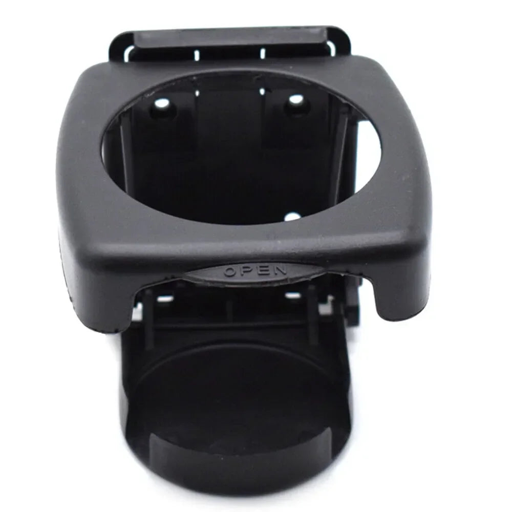 Black plastic clip holds beverage or cup, mounts in car for easy access. Fits coffee, bottles, and cans. Durable for travel.