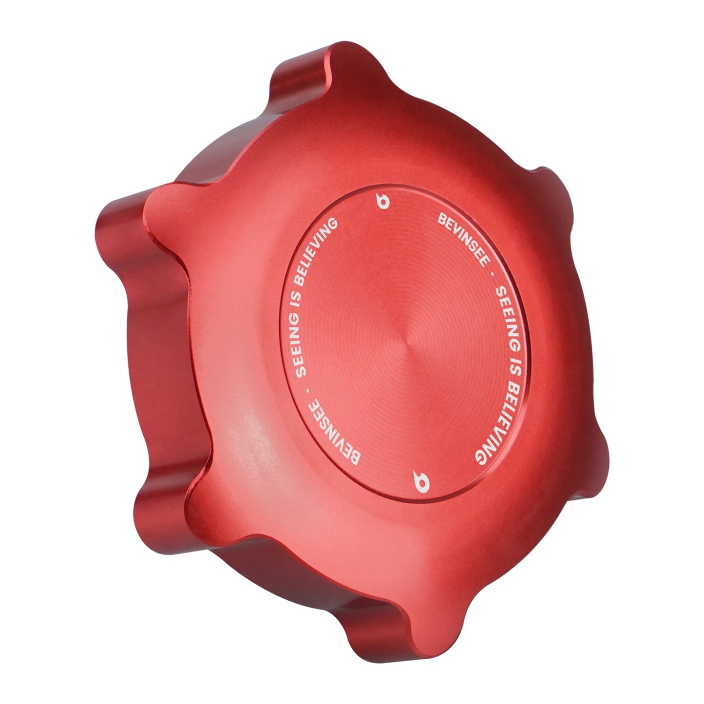 Red aluminum cap with BMW logo, attached to engine cover.