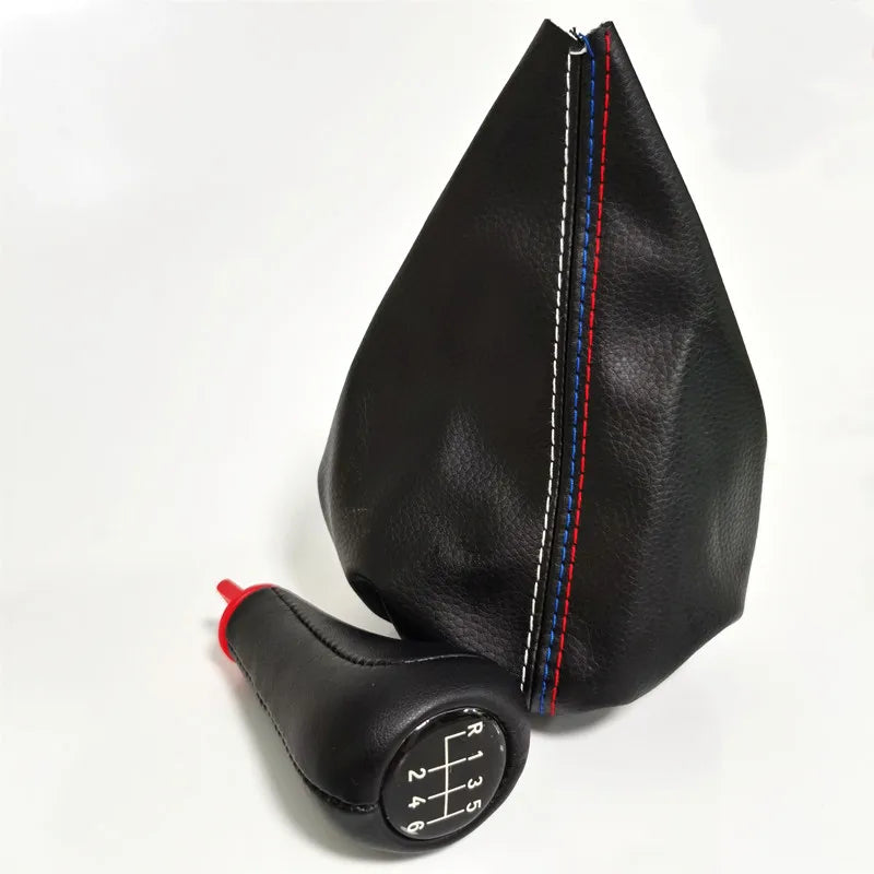 Black leather shift knob gaiter with accented stripes for BMW 3 Series cars.