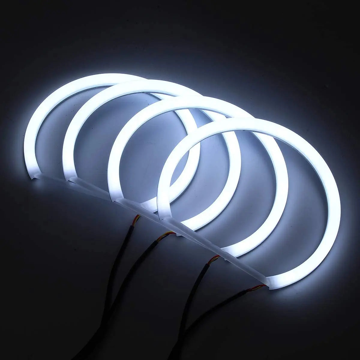 Four BMW E36/E39 LED halo rings with white and amber lights, featuring 131mm diameter 3M LED strips.