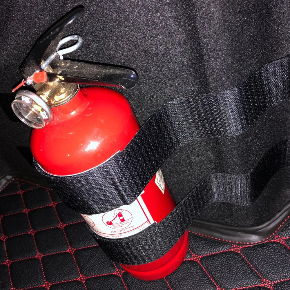 Car trunk bag holds 4 fire extinguishers with belts. Fits rear seats. Ideal for vehicle safety.