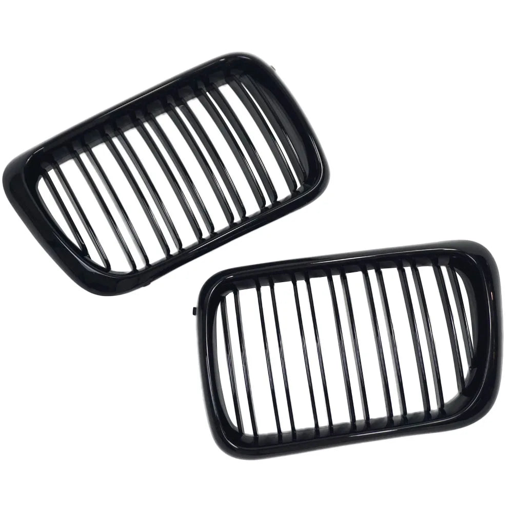 "Gloss Black Kidney Grilles for BMW E36 (1997-1999). Replacement grille part in black plastic."