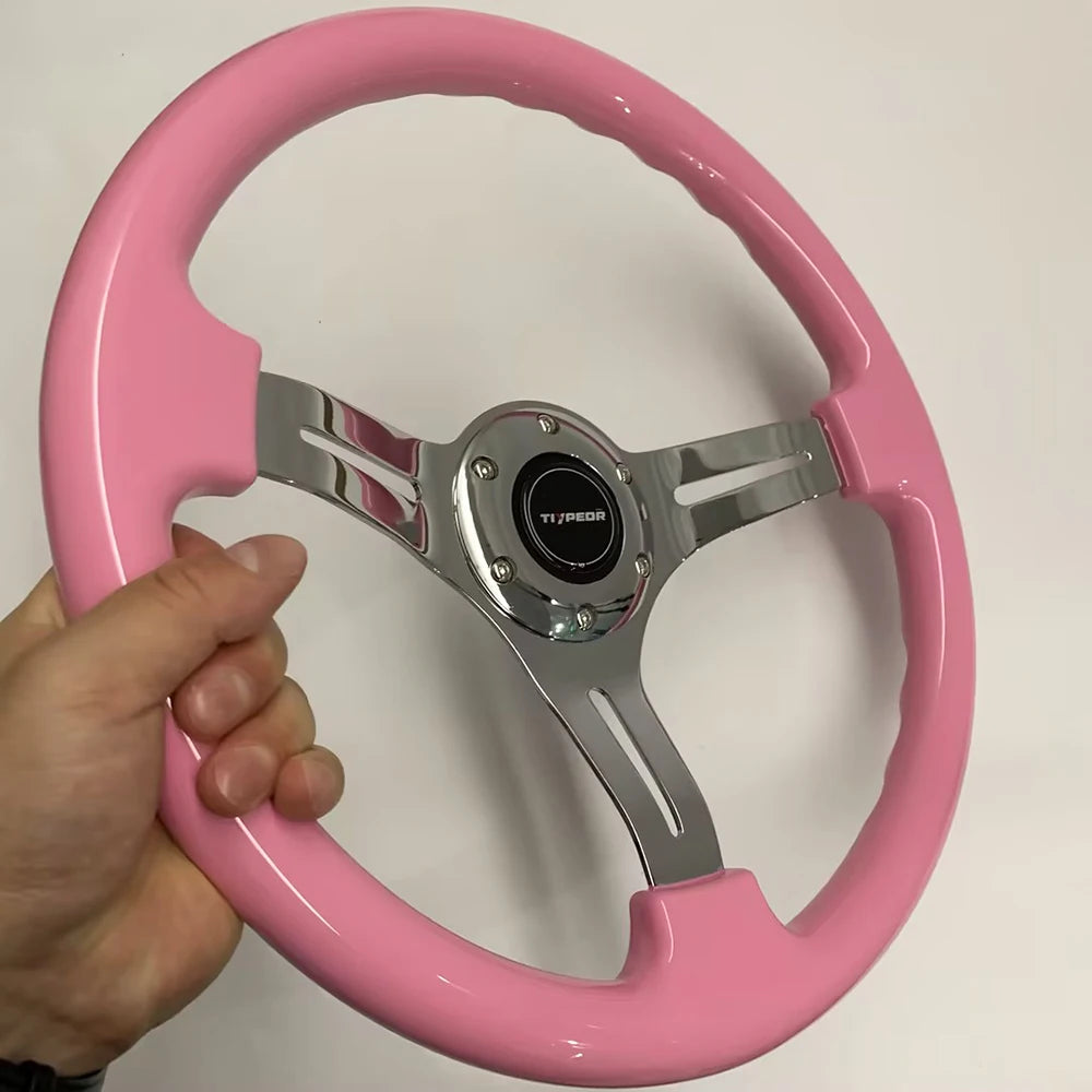 '14in pink ABS steering wheel on hand — fits most rigs. Alu alloy frame, 350mm diameter.'