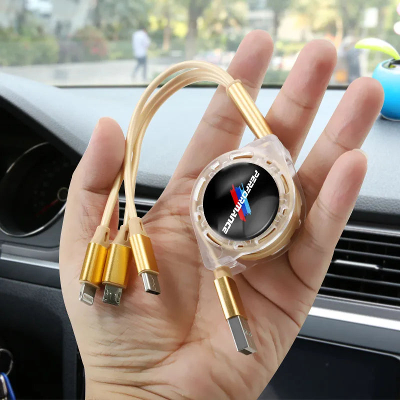 "Person holding a 3-in-1 USB-C and BMW compatible fast charging cable."