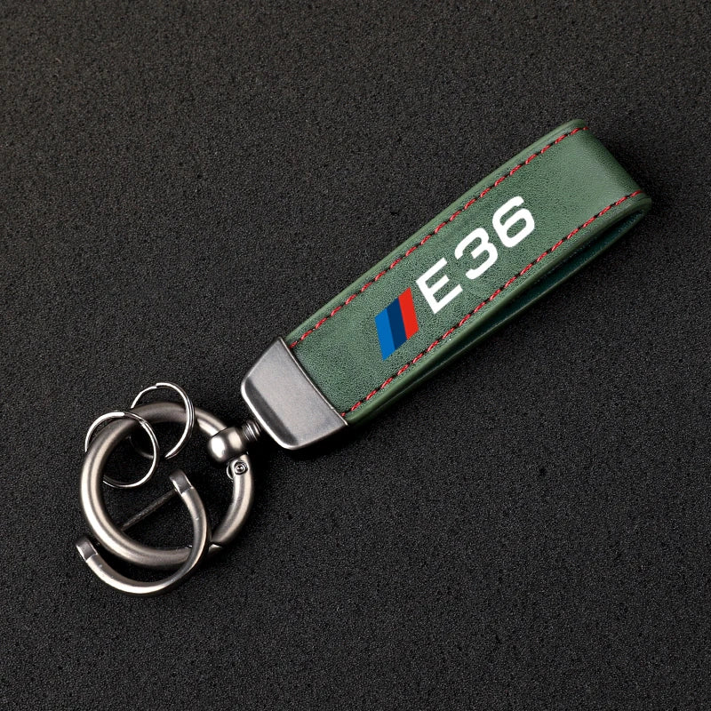 "BMW Logo Keychain for E36, E39, and E46 models. Sleek leather lanyard holds up to five keys."