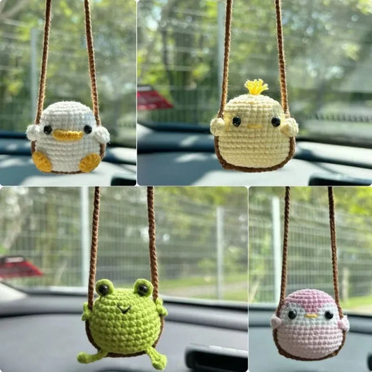 'Handmade knitted frog car charm with bird accent - 4.5cm diameter.'