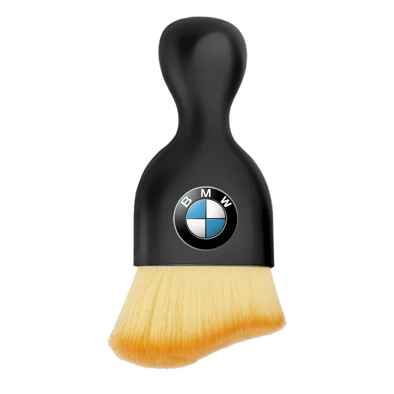 Black-colored brush featuring a BMW logo.

Or

Black brush adorned with the BMW logo for an elegant writing experience.