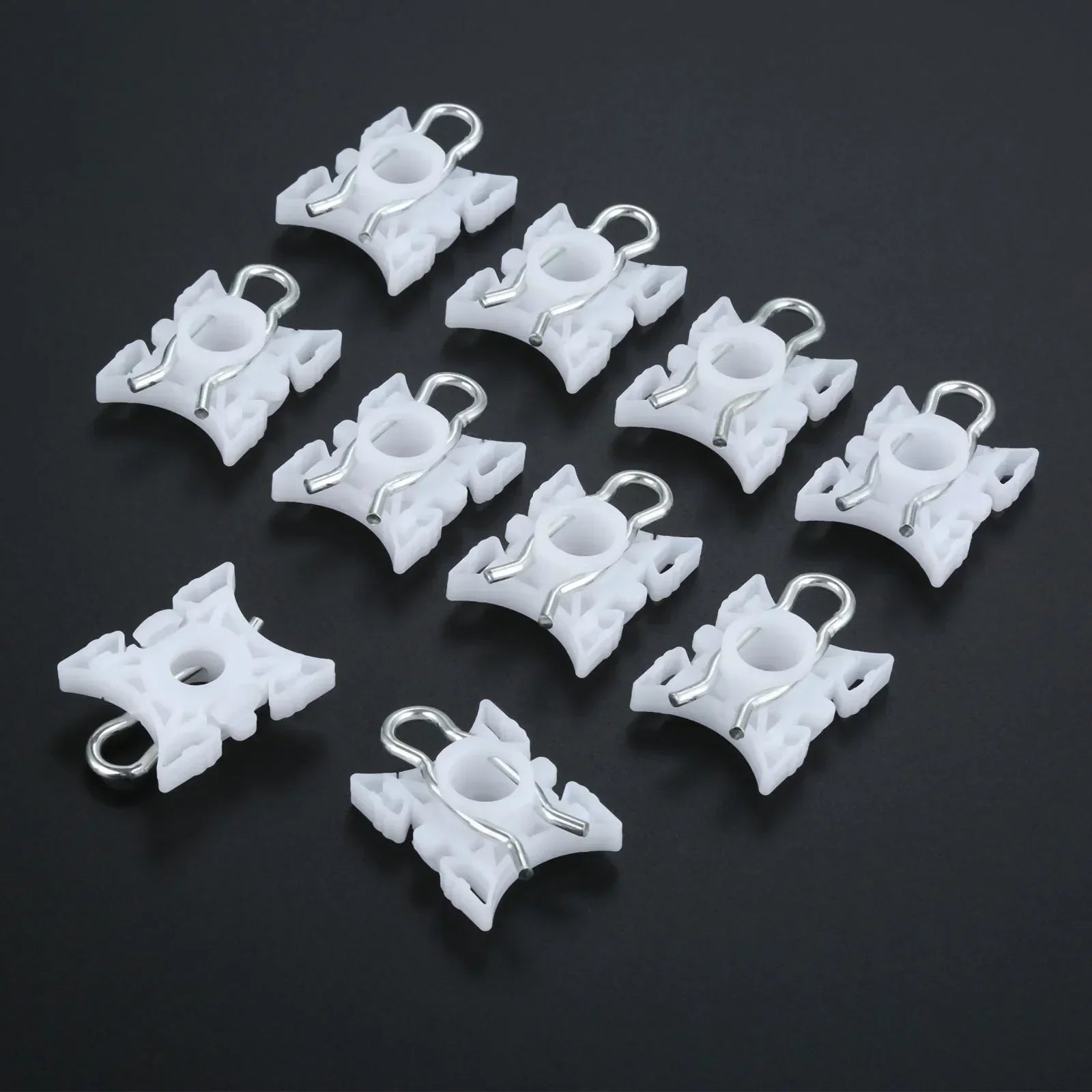 Ten white pivot clips for BMW E36 window regulators.