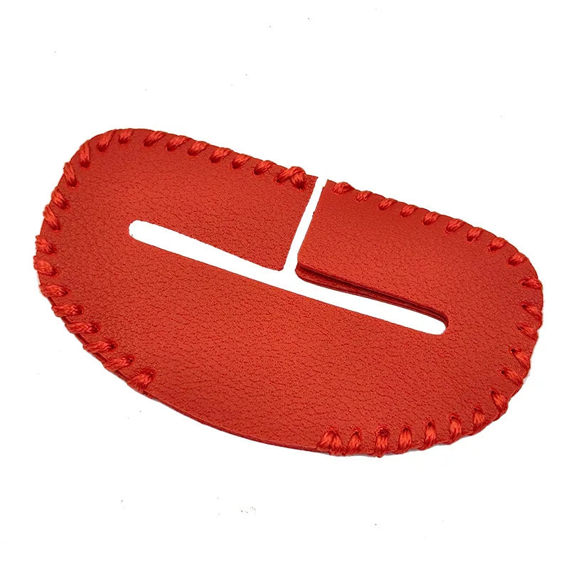 Red leather car seat buckle protector against scratching, set against clean white background. Product measures approximately 