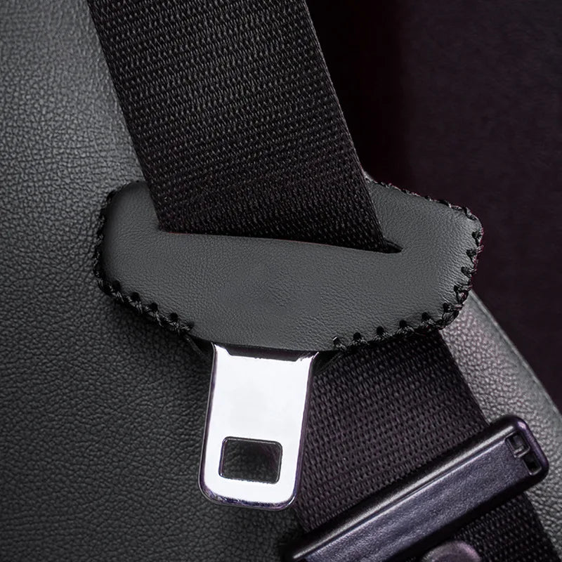 Black leather pouch with metal buckle—fits car seat belt buckle. Protects from scratches and adds style. Measures approximate