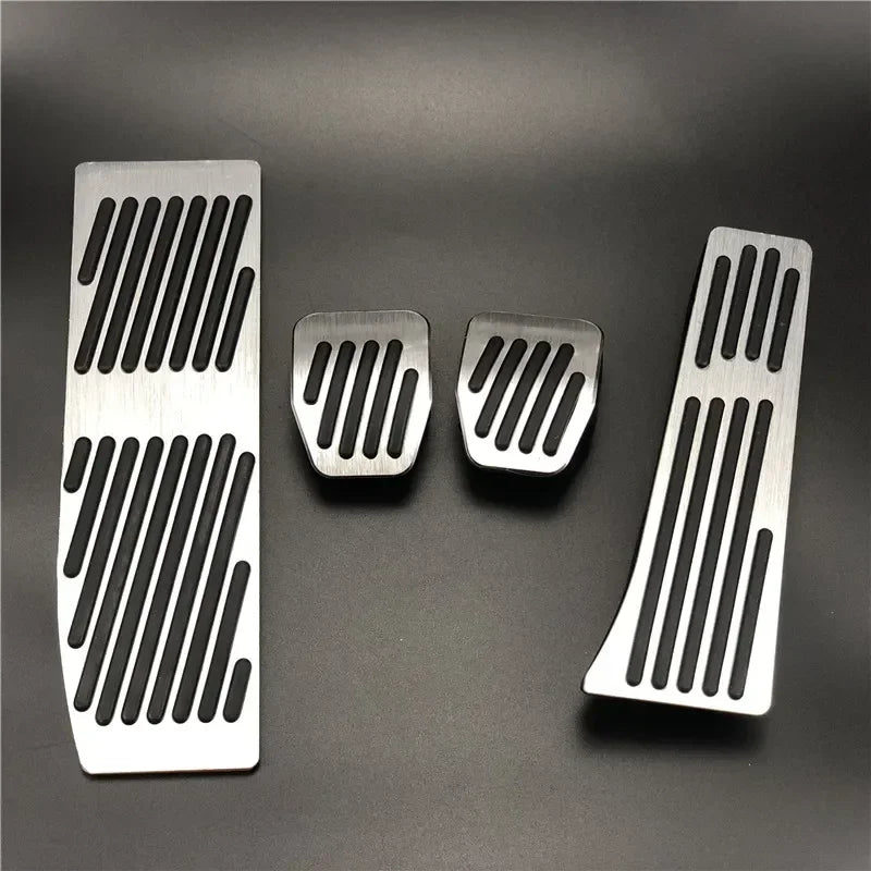 "Silver-black aluminum pedal covers for BMW E30, E36, E46, E90 M3 X1 vehicles. Replaces stock pedals."
