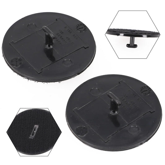 Two BMW/MINI floor mat clips in black plastic, round base.