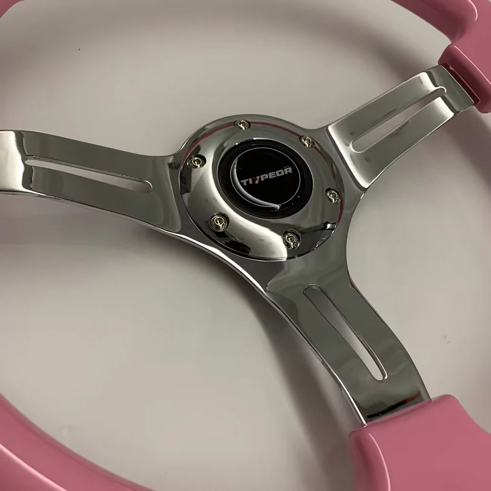 '14" ABS pink steering wheel on aluminum alloy frame with silver-accented spokes. Fits most sim rigs.'