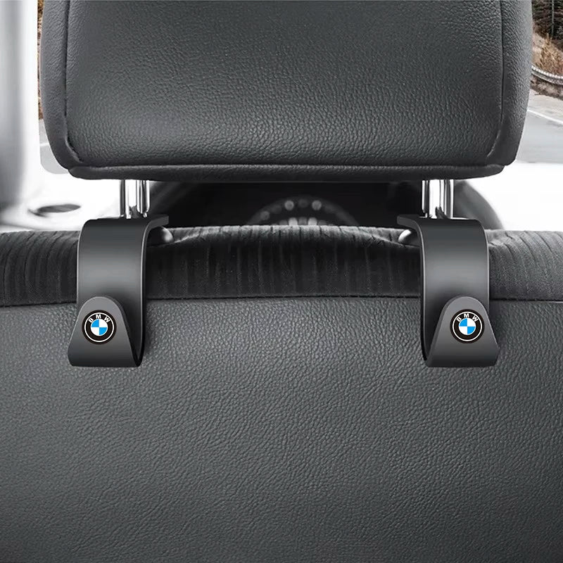 BMW original headrest hooks for securing seat belts. Leather material.