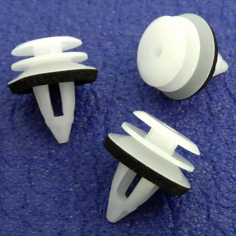 White plastic door panel clips (BMW E46) on a blue background. Set of 3.