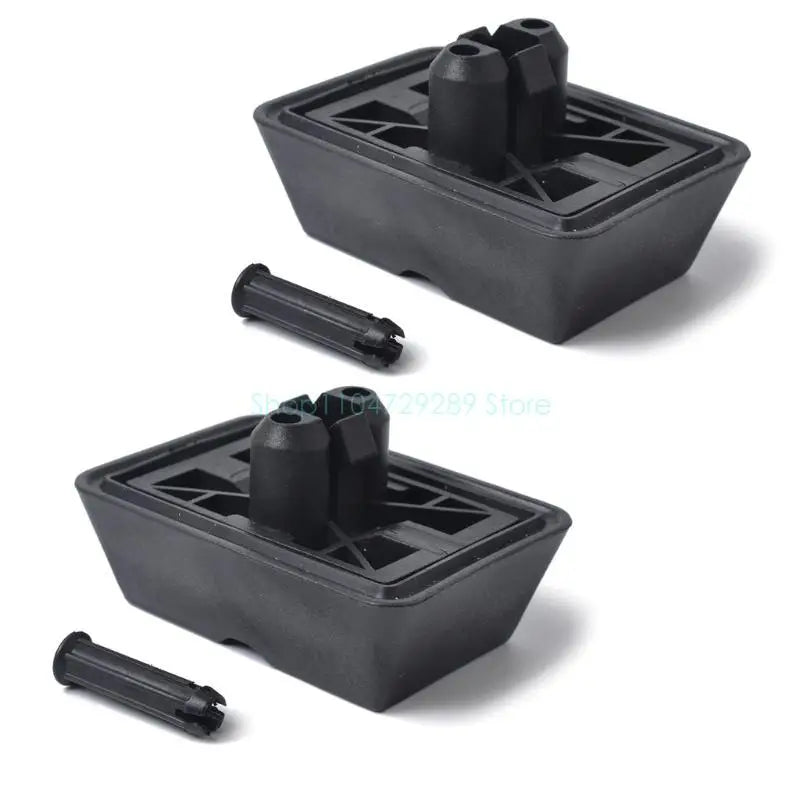 Two black BMW E46 jack pad cushions for improved stability during lifting.