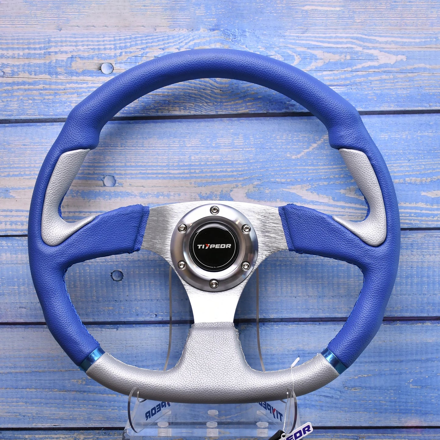 Blue leather/silver spokes racing wheel - Tiypeor 2025 model accessory. Measurements or mounting info if relevant.