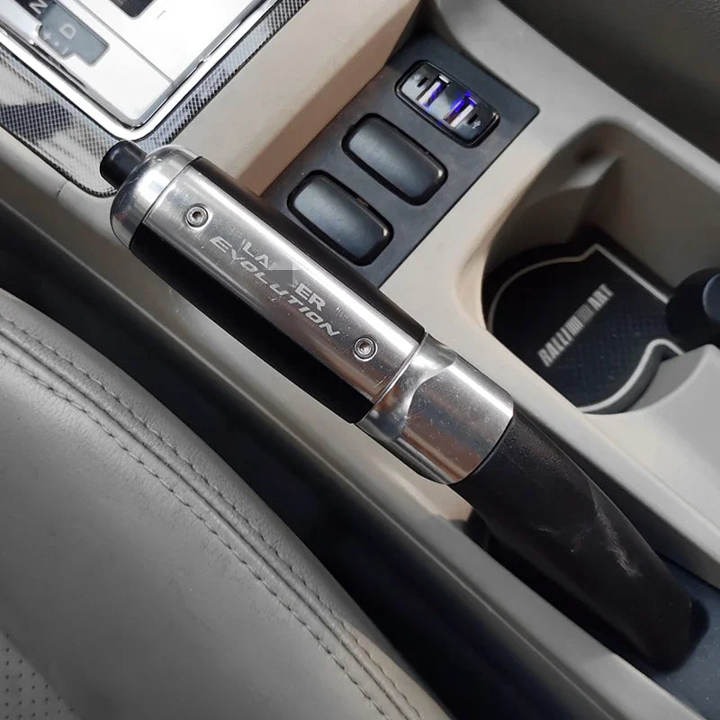 "Aluminum handbrake cover for select Mitsubishi models: Features integrated key lock."