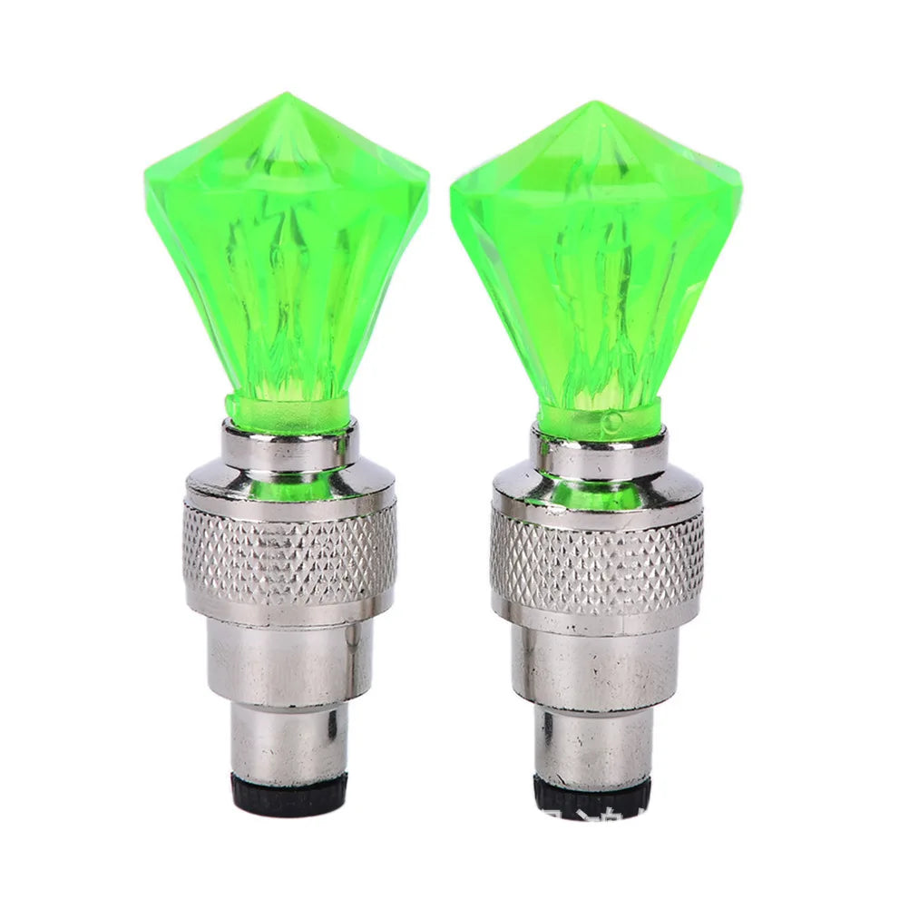 'Bike wheel lights - 2 neon valve caps with LEDs. Fits standard bike tubes. Green crystal effect.'