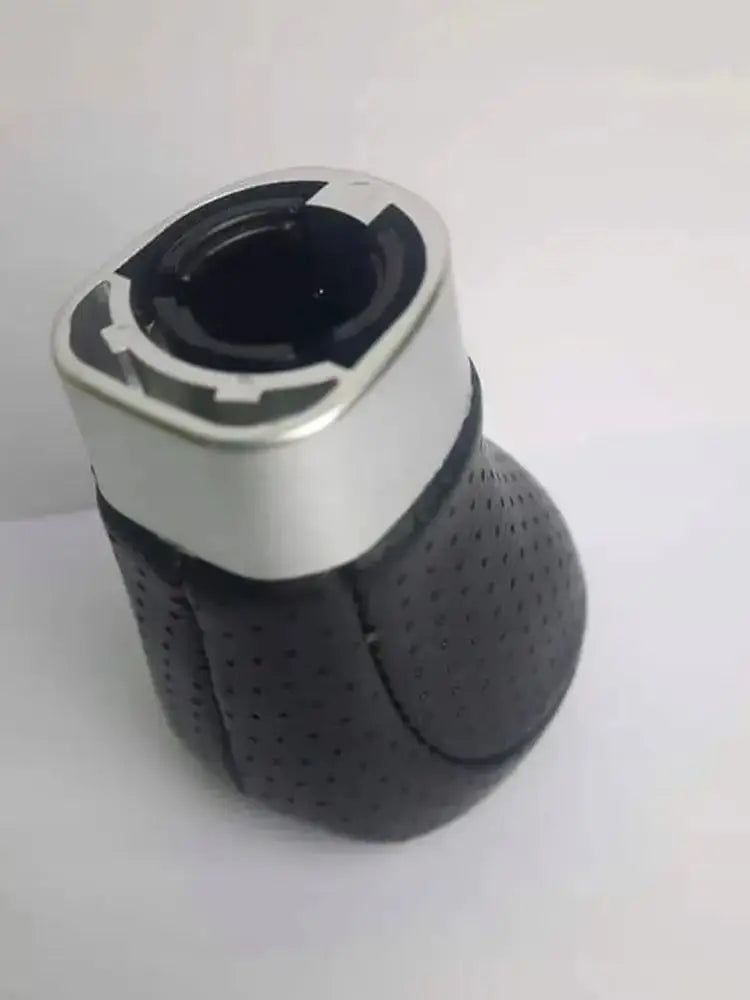 Black and white BMW M Sport gear shift knob. Textured leather grip with chrome accents for 5/6-speed manual transmission.