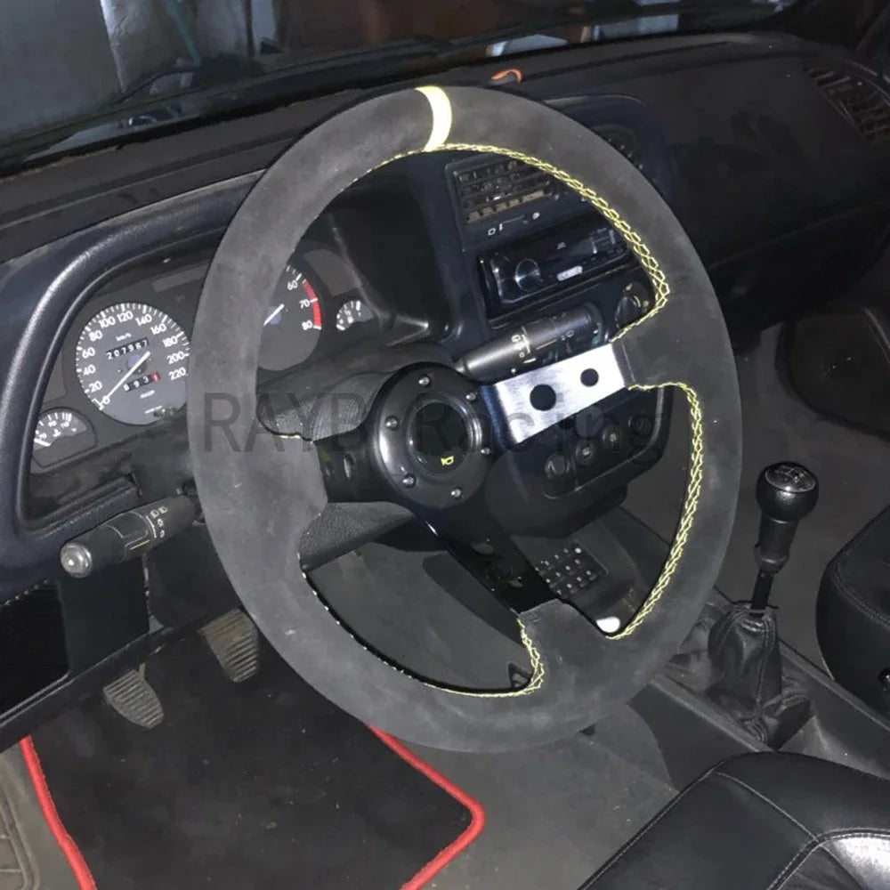 "14-inch universal corn racing steering wheel with suede/PVC/PU grip and aluminum frame. Not actual vehicle interior."