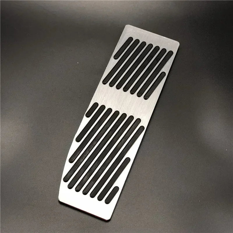 "Silver-black aluminum pedal covers for BMW E30, E36, E46, E90 M3 X1: Features distinct black and white stripe design."