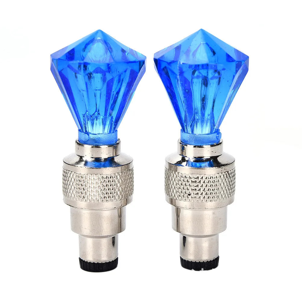 'Bicycle tire valve caps with integrated LED lights - set of 2 in blue crystal. Enhances visibility without tools.'