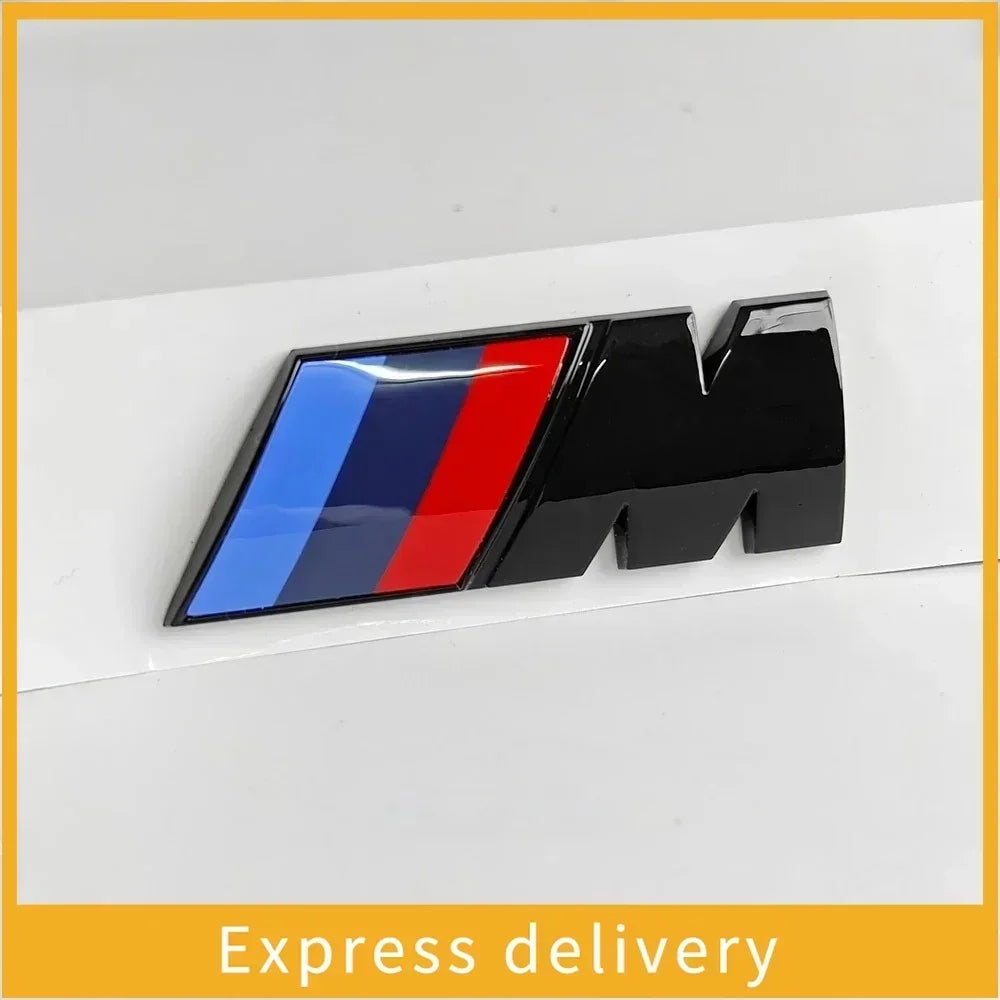 "BMW M Emblem Set: Side and rear stickers for select BMW models including E36, E34, G20, and G30 X6. Authentic BMW logo."