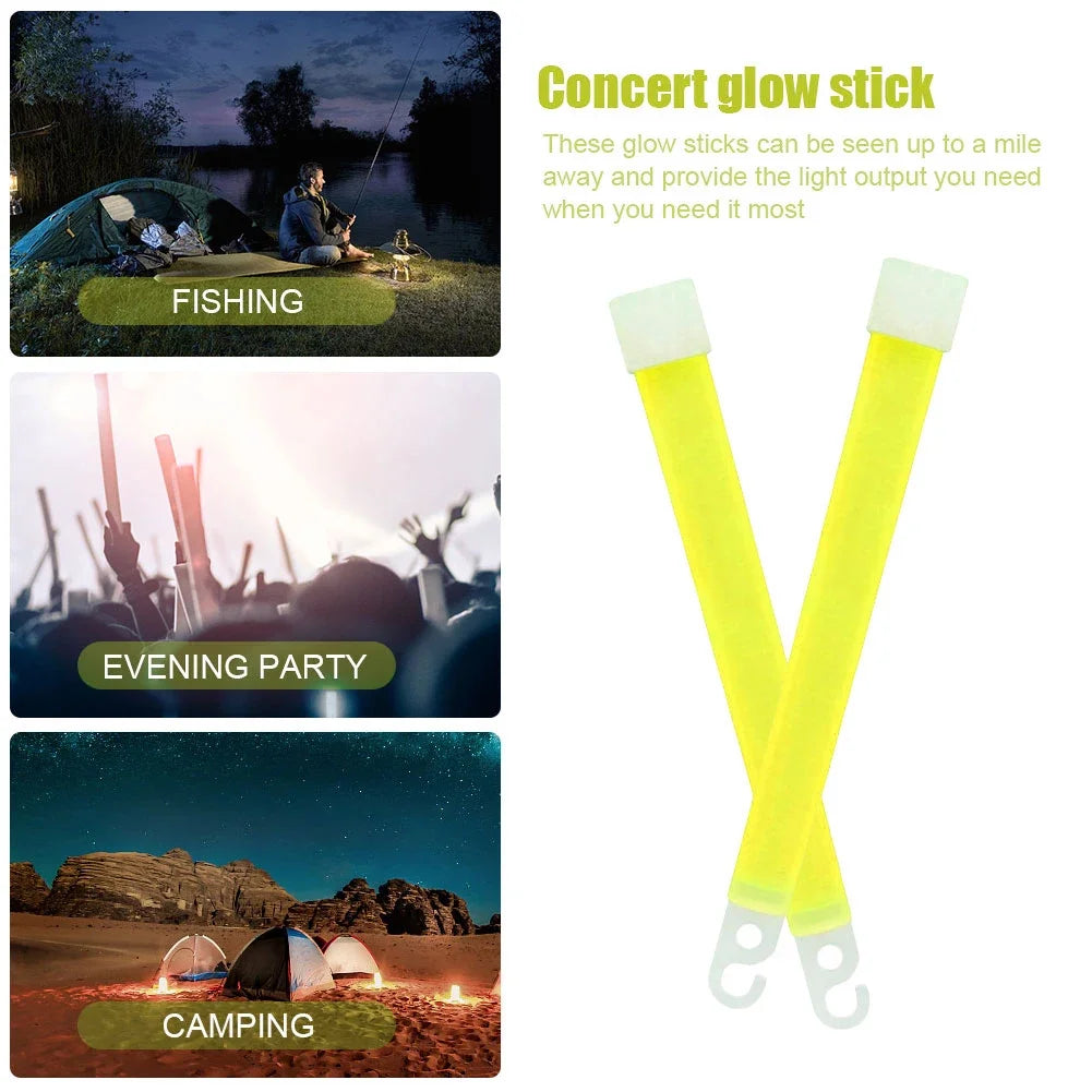 Yellow glow stick in front of a camping tent and fire. Emergency safety equipment for camping and hiking.