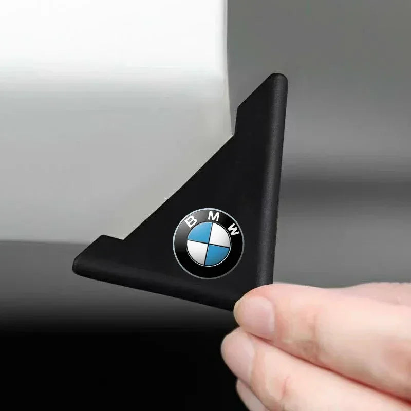 Two BMW M door corner guards: silicone anti-collision covers with BMW logo.