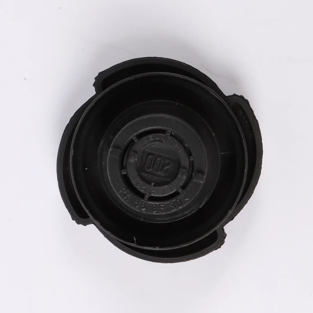 Black BMW E36 E46 radiator expansion tank cap with matching lid.