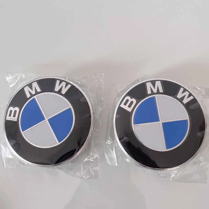 Set of 4 BMW center caps in two sizes (56mm and 68mm). Authentic BMW emblems for enhancing wheel appearance.