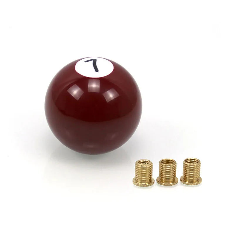 Red billiard ball-inspired shift knob with two mounting screws and a decorative brass one. Fits most cars. Universal pool sty