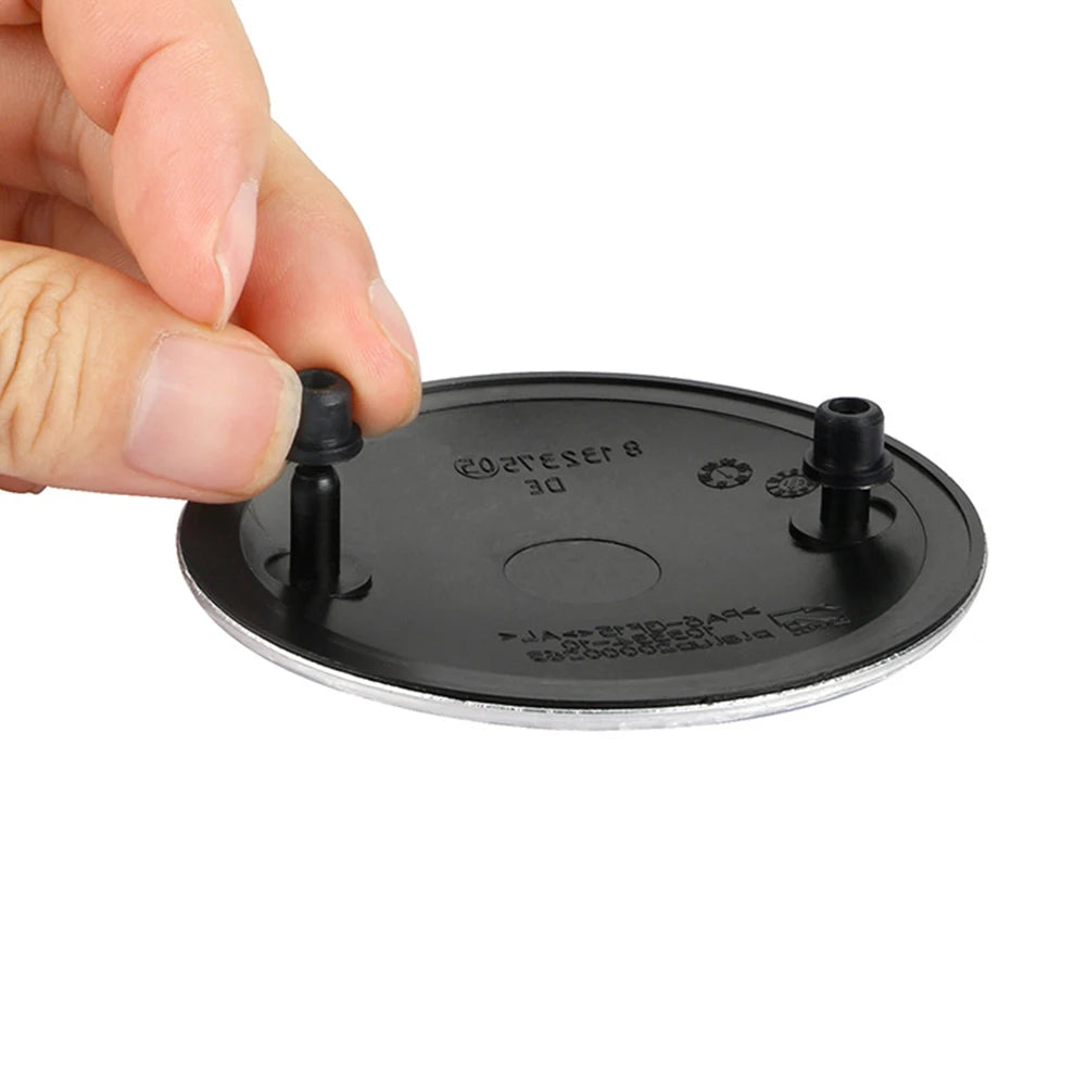 BMW emblem clips: 10 pieces in black plastic case. No lid shown.