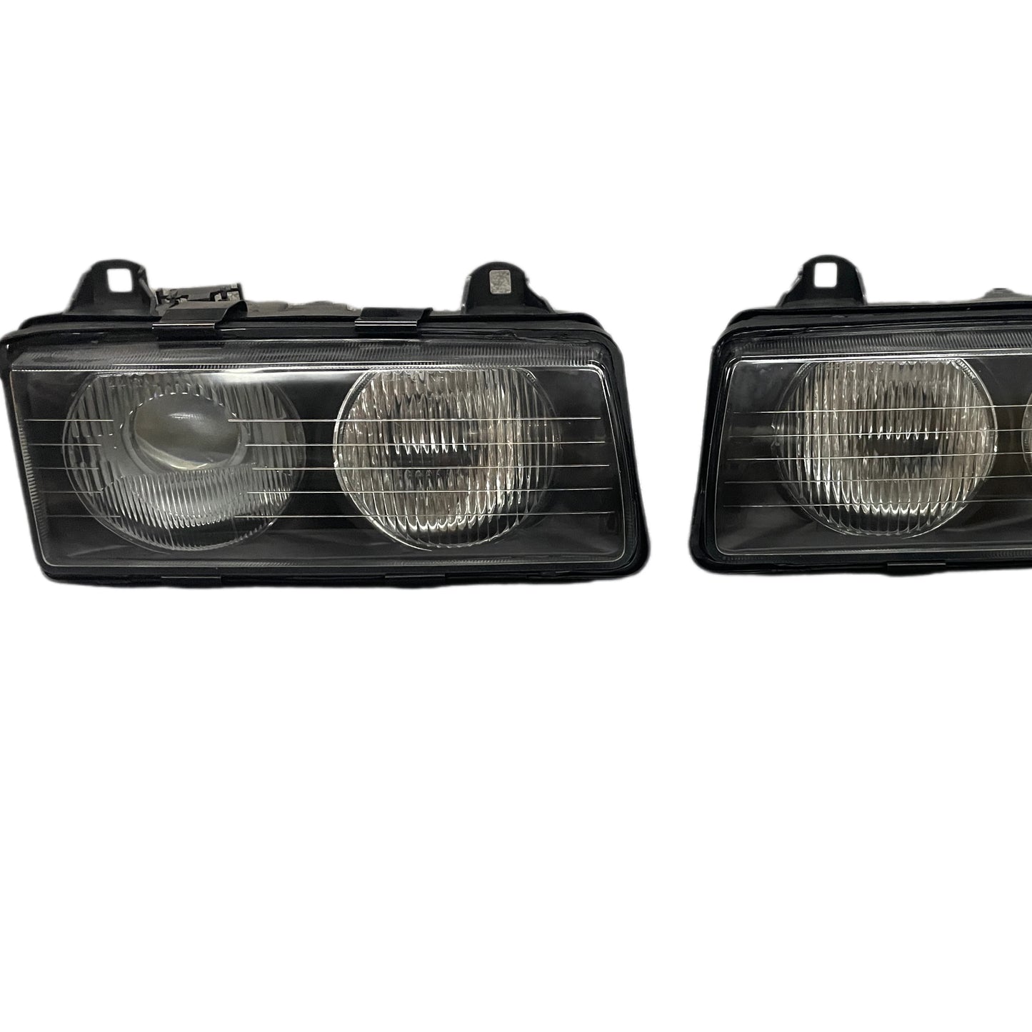 Two BMW E36 Euro Projector Headlights - Compatible with select Toyota models. Glass lens. Replacement part.
