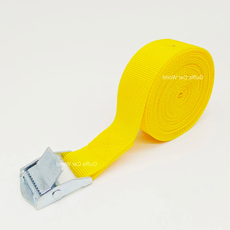 Yellow webbed cargo strap with metal buckle.

OR

Metal buckle on webbed cargo strap (yellow).