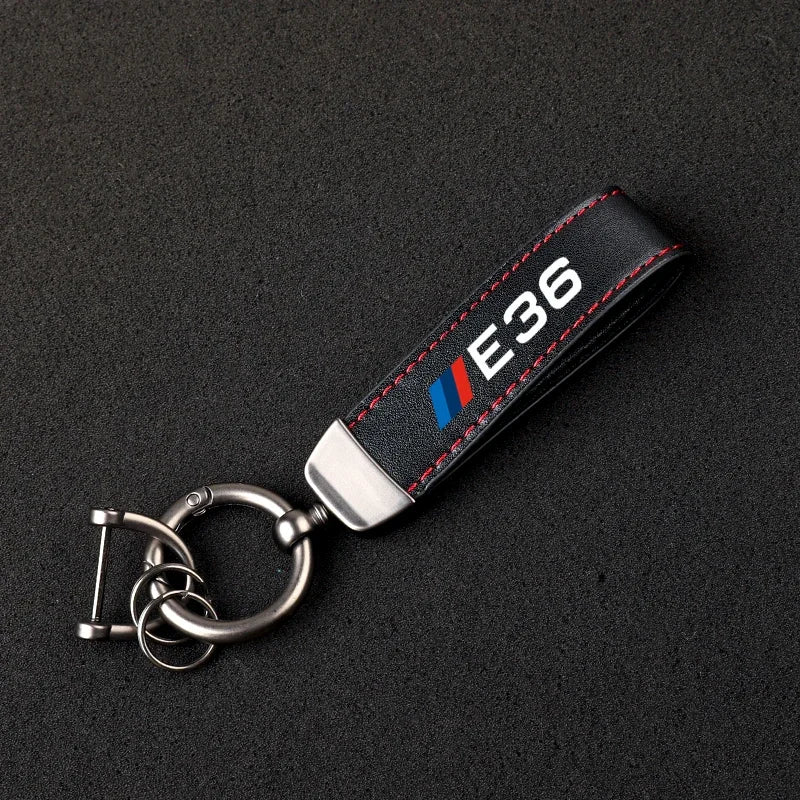 "BMW logo keychain with attached keyrings."