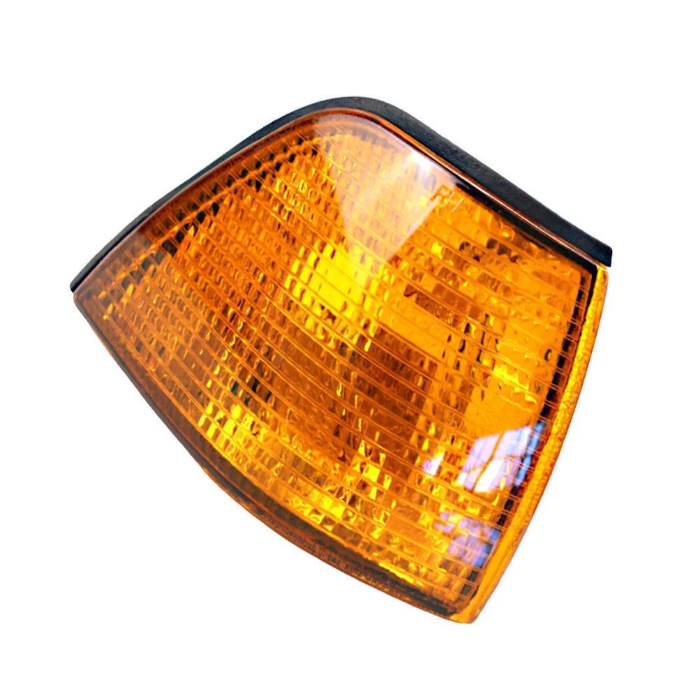 "Pair of BMW E36 4-door corner lights in yellow hue against a white background."