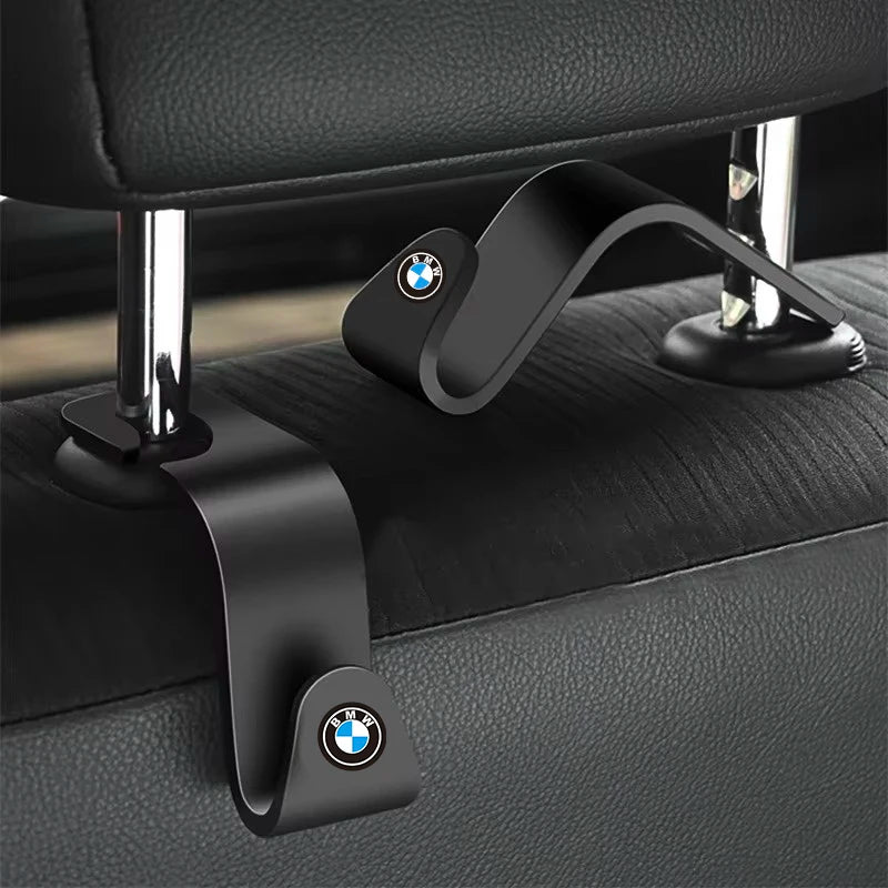 BMW emblem embellishing this high-end car seat.

Or, for a more descriptive alt text:

BMW logo prominently displayed on this sleek and modern car seat, adding a touch of luxury to your automobile experience.