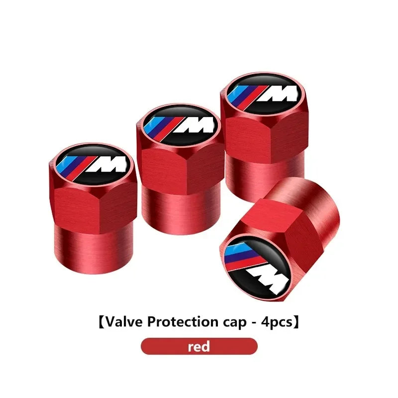 Set of 4 red aluminum BMW tire cap inserts for E36, E46, and E90 models.