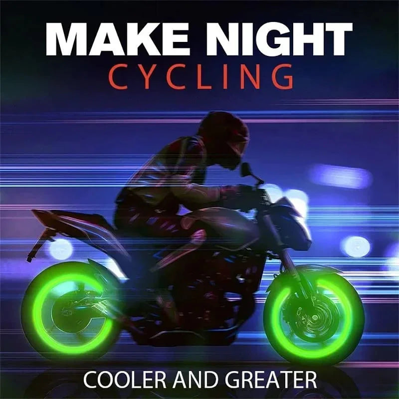 Motorcycle rider with glowing valve caps at a show. Product enhances tire detail. Fits car and bike tires.