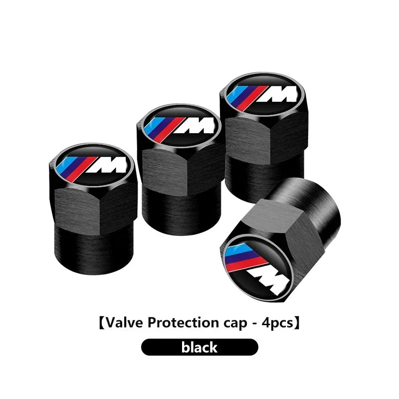 "BMW logo tire valve stem caps (4pcs) in black carbon finish for E36, E46, and E90 models."