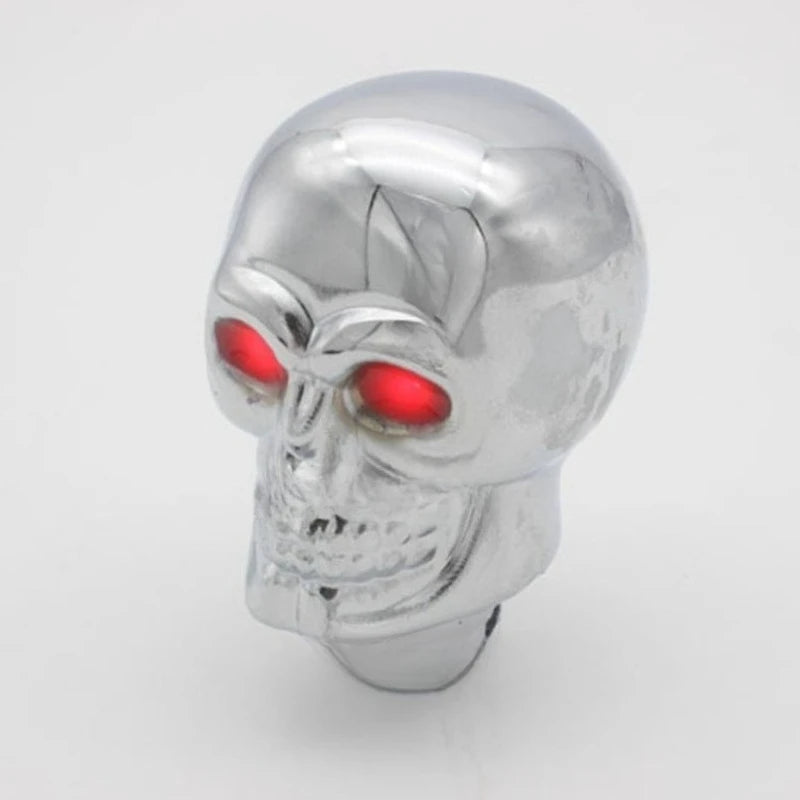 Silver Skull shift knob with glowing red eyes. (Universal for automatic and manual transmissions)