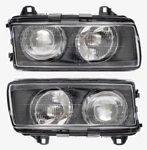 Two BMW E36 Euro Projector Headlights with glass lenses. Fits select BMW E-Class models. Replacement part.