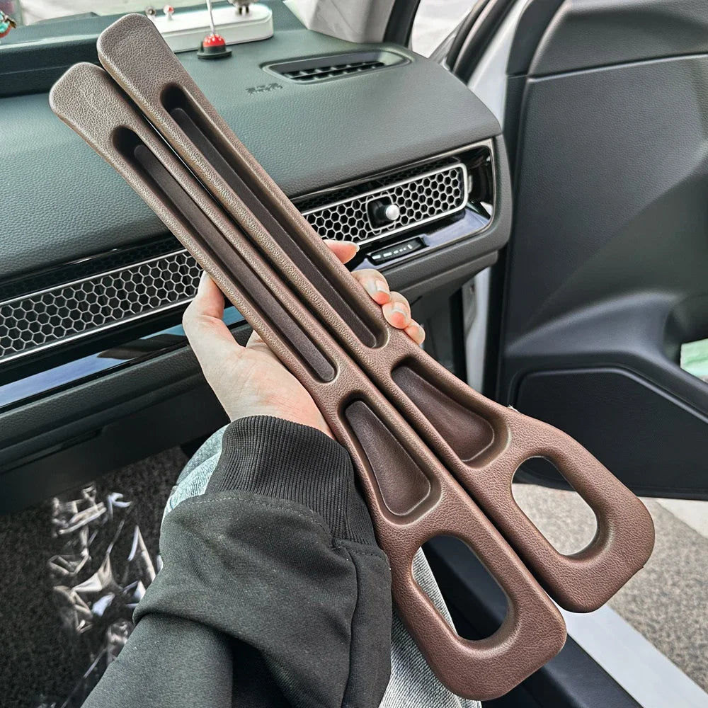 Person holding scissors for size adjustment of Universal Car Seat Gap Filler Strip - 1 pair.