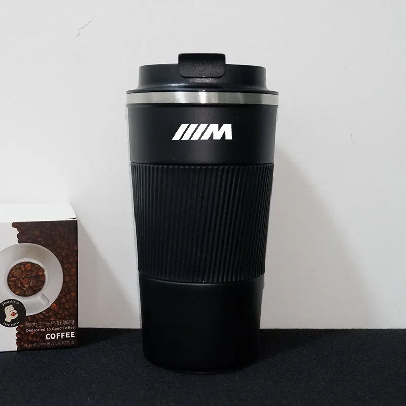 BMW M Sport Travel Mug: Sleek mug featuringBMW logo, not including coffee or container.
